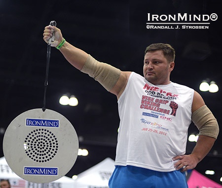 Alexey Tyukalov clamps down on the handles of a Captains of Crush No. 3 gripper to hold the CoC Silver Bullet in place for as long as he can. Tyukalov is a former world record holder in the event. IronMind® | Randall J. Strossen photo