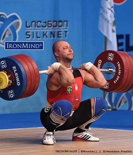 Bartolmiej Bonk hits the bottom with 223 kg—he pocketed two gold medals and one silver in the 105-kg class at the 2015 European Weightlifting Championships. IronMind® | ©Randall J. Strossen