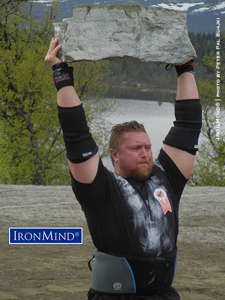 Casey Garrison (USA) on the stone press at the IHGF Stones of Strength competition in Vinstra, Norway. IronMind® | Photo by Peter Pal Buajk