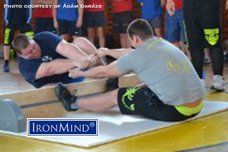 Mas wrestling—a sport with ancient, global roots that has been callled “close quarters tug of war—debuted in Slovaki and IHGF CEO Francis Brebner reported on the action for IronMind.
Richárd Várnai (Hungary) and Tamás Sidó (Slovakia) go at it when mas wrestled debuted in Slovakia. IronMind® | Photo courtesy of Ádám Darázs