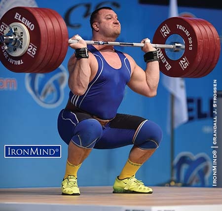 Oleg Proshak meets the bar on his 235-kg third attempt clean and jerk at the 2015 European Weightlifting Championships. IronMind® | ©Randall J. Strossen photo
