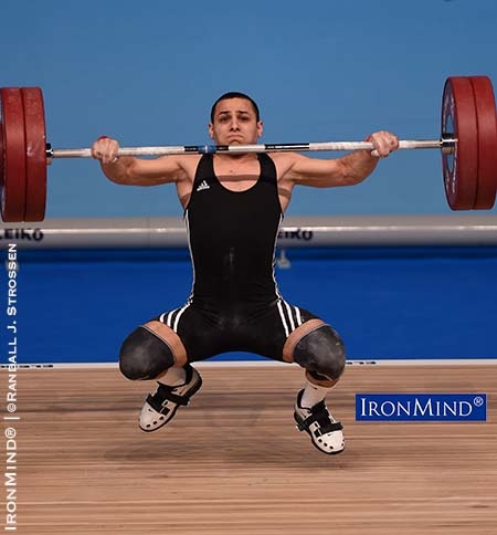 Tbilisi—Coming back from a two-year suspension, Valentin Hristov (Azerbaijan) sparkled at the European Weightlifting Championships today—sweeping the gold medals in the 62-kg class. In a sport filled with fast twitch wonders, Valentin Hristov is a standout—he’s cracking sharp, accelerating the bar one instant and then, in a flash, reversing directions and getting his body under it. IronMind® | ©Randall J. Strossen photo