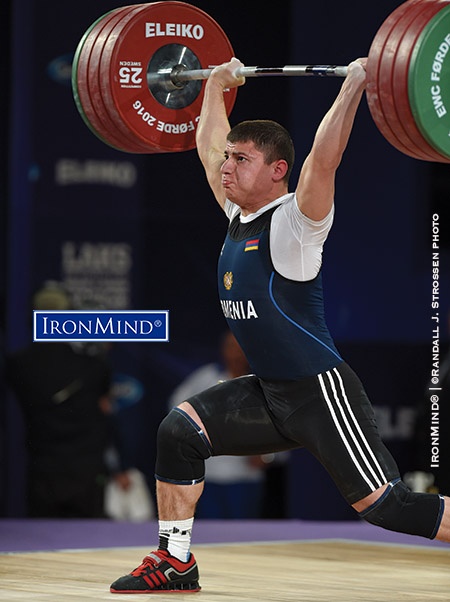 Andranik Karapetyan (Armenia) punched through this 197-kg jerk, en route to winning all three gold medals in the men’s 77-kg category at the 2016 European Weightlifting Championships. IronMind® | ©Randall J. Strossen photo