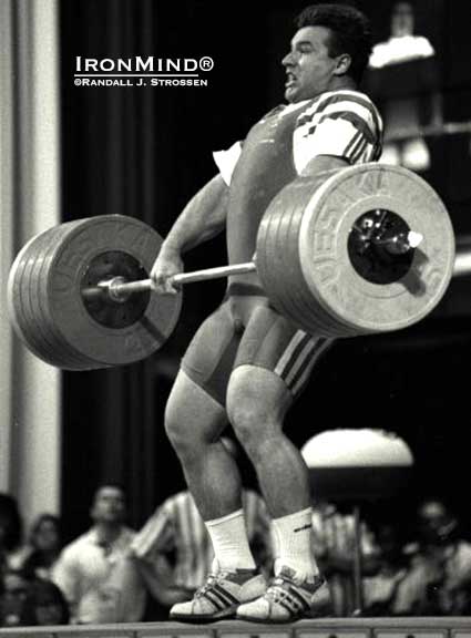 Stefan Botev, lifting for Australia, races to get under this 255-kg clean at the 1996 Olympics (Atlanta, Georgia). IronMind® | Randall J. Strossen, Ph.D. photo  