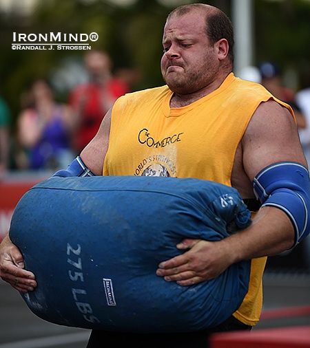 dave-oslund-ironmind-sandbag-wsm David Ostlund, shown competing in last year’s World’s Strongest Man contest, will be at the Los Angeles FitExpo this weekend, competing in the All-American Strongman contest. IronMind® | Randall J. Strossen photo