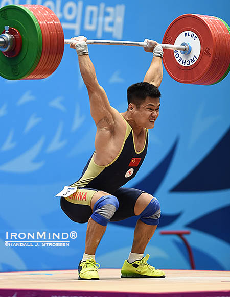 Gold medal lift: after missing the jerk twice with 200 kg, Lyu Xiaojun showed his grit by making a good lift with the weight on his third attempt. IronMind® | Randall J. Strossen photo
