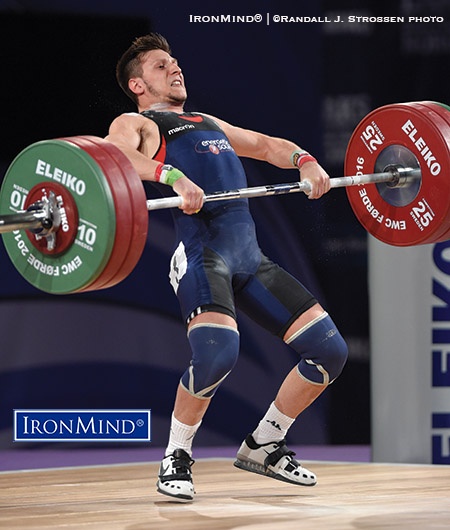 56-kg winner at the European Weightlifting Championships, Mirco Scarantino (Italy) pulls himself under 150 kg on his third attempt in the clean and jerk. IronMind® | ©Randall J. Strossen photo