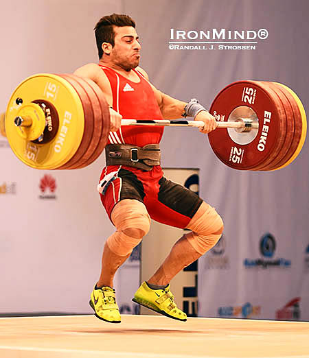 Kianoush Rostami (Iran) pulls himself under 213 kilos, in what proved to be the winning lift for both the clean and jerk, and the total. IronMind® | Randall J. Strossen photo 