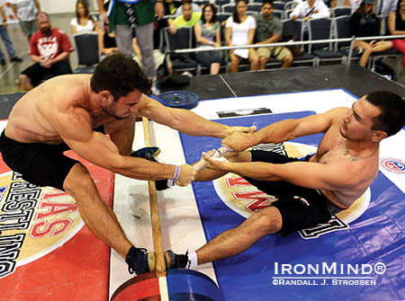 Sean Couch (left) gets launched by world champion Alexandr Arinkin at the North American Mas Wrestling Championships (held at the San Jose FitExpo earlier this summer). Couch will be a member of Team USA at the 2014 Mas Wrestling World Championships in Yakutsk, Russia in November. IronMind® | Randall J. Strossen photo