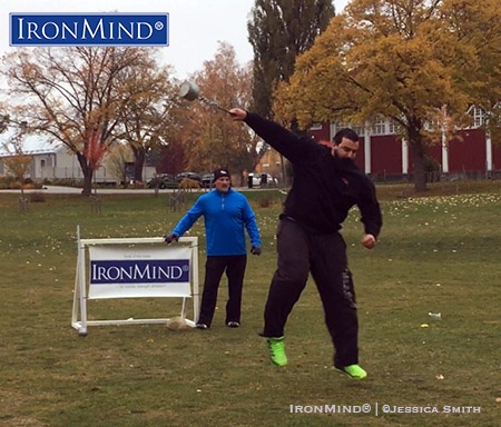 Aron Cato Vingren works on the weight for distance, under the watchful eye of IHGF president Francis Brebner. The IHGF is working to expand the Highland Games heavy events in Sweden. IronMind® | ©Jessica Smith photo