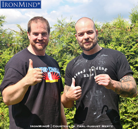 carl-august mertz jan heller IronMind Red Nail Jan Heller (right) has just been certified on the IronMind Red Nail and after his official bend, his referee, Carl-August Mertz (left), who is certified on both the Red Nail and the Captains of Crush No. 3 gripper, hosted a barbecue. IronMind® | Photo courtesy of Carl-August Mertz
