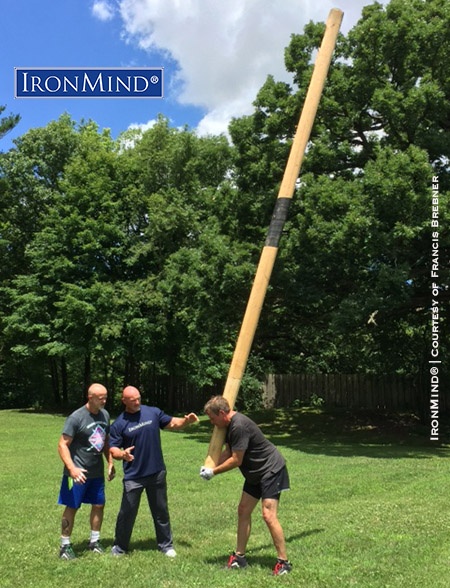(left to right: Lonnie Captain Marvel, Francis Brebner, Jamie Munson) Before, it was a caber they couldn’t turn, but after a little coaching from Francis Brebner, Captain Marvel and Jamie Munson tossed the stick. IronMind® | Photo courtesy of Francis Brebner