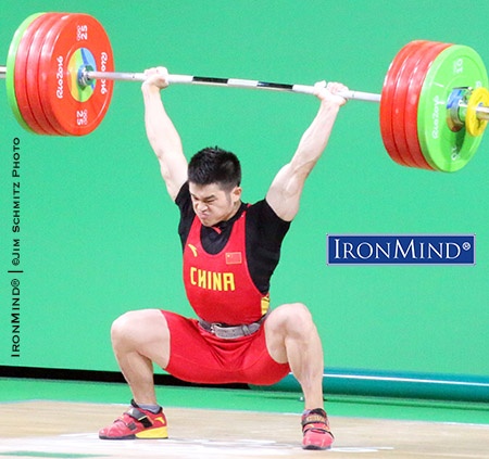 Shi Zhiyong (China) won the men’s 69-kg class in weightlifting at the Rio Olympics. Shi cleaned 198 kg in an attempt to break the world record in the total, and had the weight overhead, but he lost the lift as he tried to stand up. IronMind® | ©Jim Schmitz photo