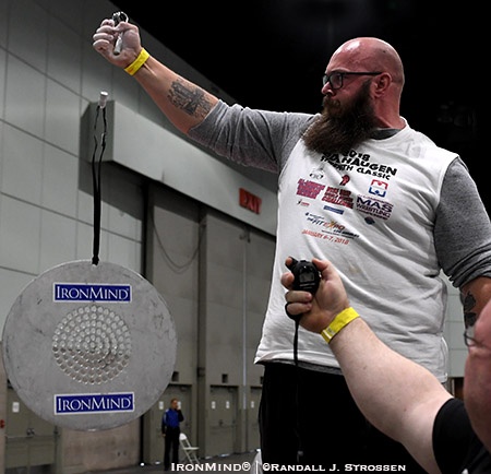 Clay Edgin attacked the CoC Silver Bullet with the Captains of Crush No. 4 gripper at the Armlifting USA grip contest at the 2018 Los Angeles FitExpo. IronMind® | ©Randall J. Strossen