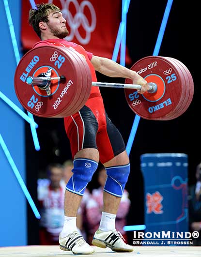 Apti Aukhadov (Russia) finishes his pull on a successful 175-kg snatch in the 85-kg category at the London Olympics.  The training lift Jim Schmitz discusses—Tommy Kono High Pulls to a Stick—are designed to ensure that when you do pulls, you are hitting the necessary height.  IronMind® | Randall J. Strossen photo.