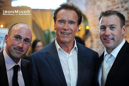 California Governor Arnold Schwarzenegger (center) added his considerable clout to the fundraising efforts of Kevin (left) and Paul Doherty (right), two brothers who have more than gone the extra mile in their schools to build an Olympic-style weightlifting program that uses athletic achievement to create multiple opportunities for their students.   IronMind® | Randall J. Strossen photo. 
