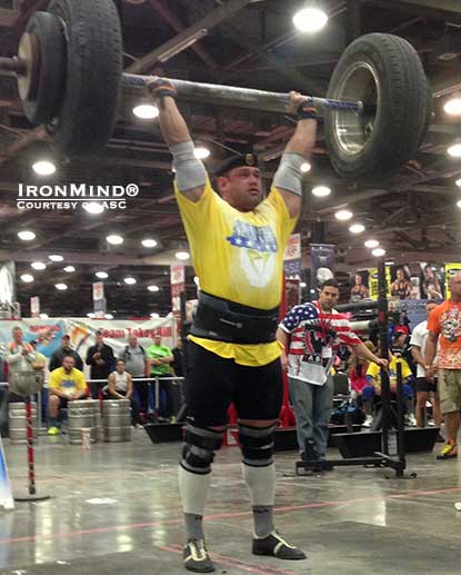 Mikhail Shivlyakov (Russia) on the IronMind Apollon’s Axle, on his way to winning the Arnold Amateur Strongman competition.  IronMind® | Photo courtesy of ASC.