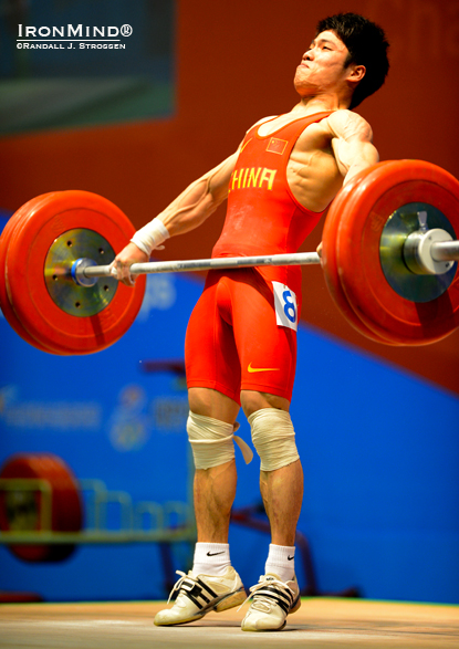 Li Fabin finishes his pull on this 126-kg snatch as he won the men’s 56-kg category at the 2012 Asian Weightlifting Championships.  IronMind® | Randall J. Strossen photo.