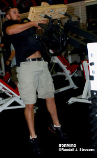 Bert Sorin, who will debut in Pleasanton as a top contender in the Amateur A class, demonstrates the caber training attachment for the Hurricane, a unique machine developed by Sorinex. Richard Sorin describes the Hurricane as being a link between free weights and machines, and Bert Sorin swears by its effectiveness for boosting his Highland Games performance. IronMind® | Randall J. Strossen, Ph.D. photo.