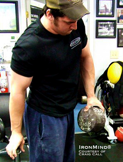 Craig Call has proven that he has world class grip strength, just certifying on the Captains of Crush® (CoC) No. 3 gripper and shown here hoisting Richard Sorin’s “ original blob to full lockout” at Sorinex.  IronMind® | Courtesy of Craig Call.