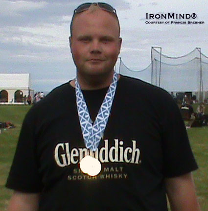 Craig Sinclair sports his two British Hammer Championships medals.  IronMind® | Photo courtesy of Francis Brebner.