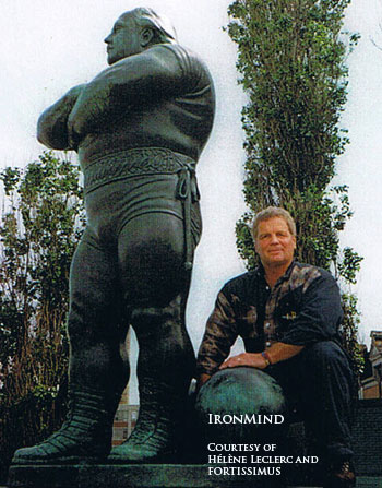 Paul Ohl and the statue of Louis Cyr.  IronMind® | Photo by Hélène Leclerc.