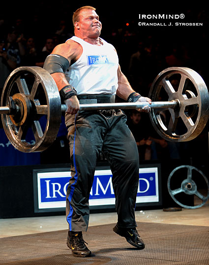 Derek Poundstone on his way to setting a new world record (414 lb.) on the Apollon’s Axle at the Giants Live World’s Strongest Man Qualifier held at the Mohegan Sun earlier this year.  Presenter Colin Bryce called it the highlight of the contest and said that he wished there had been a decibel meter to measure the crowd’s response as they roared for Poundstone when he made this lift.  IronMind® | Randall J. Strossen photo.