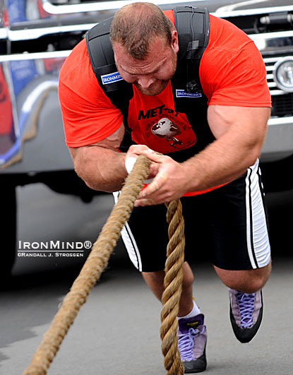 Derek Poundstone lives up to his name as he pounds toward the finish line in the Truck Pull at the 2011 MET-Rx World’s Strongest Man contest.  IronMind® | Randall J. Strossen photo.