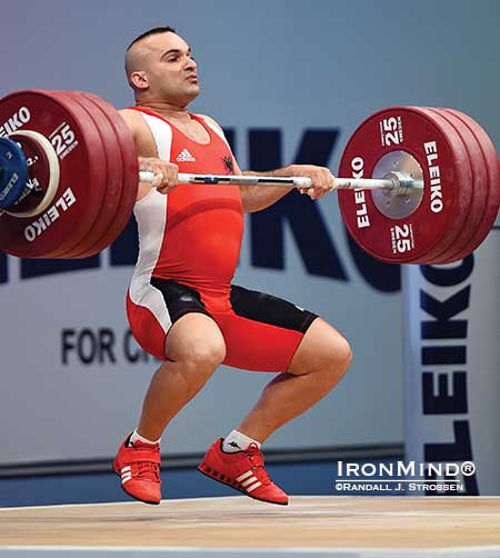 Erkand Qerimaj (Albania) flies under 194 kg in the clean and jerk, adding a gold medal in the total to the one he'd already harvested in the clean and jerk in the 77-kg class at the European Weightlifting Championships in Tel Aviv.   IronMind® | Randall J. Strossen photo