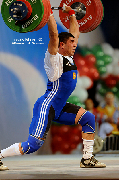 85-kg competitor Gevorik Pogoshian (Armenia) punches up 204 kg to claim the gold medals in the clean and jerk as well as the total at the European Weightlifting Championships.  IronMind® | Randall J. Strossen photo.