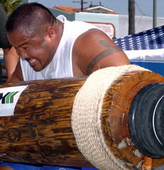 Grant Higa, who will be competing at the FitExpo, attacks the log at the 2004 Battle of Muscle Beach (Venice, California). IronMind® | Randall J. Strossen, Ph.D. photo.