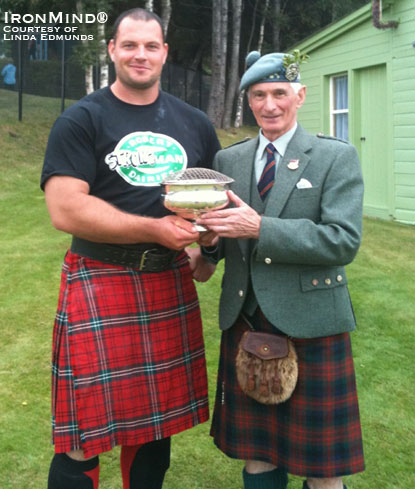 Pictured with the Convenor of the Braemar Highland Games, Gregor Edmunds (left) upheld the pride of Scotland as he won this most coveted heavy events title, his second victory at Braemar.  IronMind® | Photo courtesy of Linda Edmunds. 