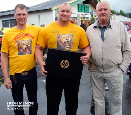 Height runs in his family: Haffþór (center), who stands 205 cm tall, is flanked by his 203-mm tall father (left) and his 207-cm grandfather (right).  Incidentally that HP laptop Haffþór is holding was his prize for winning the OK Budar Strongman Championships in Iceland last weekend.  IronMind® | Photo courtesy of Hjalti Arnason.