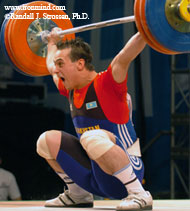Ilya Ilin (Kazakhstan) sinks the putt on this 168-kg snatch, as part of his riveting performance in the 85-kg category at the 2005 Junior World Championships (Busan, Korea). IronMind® | Randall J. Strossen, Ph.D. photo.