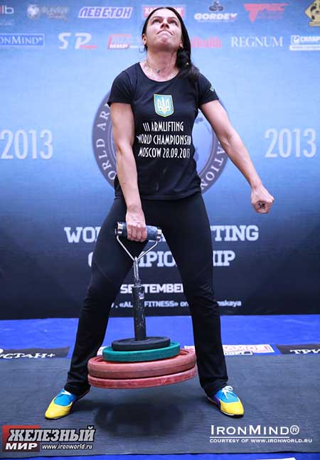 Iryna Postnikova attacks 68 kg on the Rolling Thunder® at the 2013 Armlifting World Championships.  IronMind® | Photo courtesy of www.ironworld.ru.