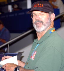 Jim Schmitz in his position as the MILO reporter covering weightlifting at the 2004 Olympics (Athens, Greece). IronMind® | Randall J. Strossen, Ph.D. photo.