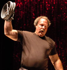 "It ain't no garden hose." John Brookfield provided the halftime entertainment at this past weekend's IRONMAN Pro (held at the FitExpo), and one of the things the master traditional strongman did was wind up a steel bar that was 20-feet 6-inches long and 1/2-inch in diameter - which he then popped into a US Priority Mail box, to prove how tightly it was coiled. IronMind® | Randall J. Strossen, Ph.D. photo.