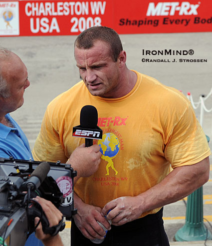 Strongman hits the big time at the World’s Strongest Man contest with major media coverage for the strongman contest that created the concept.  Here, Bill Kazmaier (left) interviews Mariusz Pudzianowski (right) for ESPN at the 2008 MET-Rx World’s Strongest Man contest.  IronMind® | Randall J. Strossen photo.