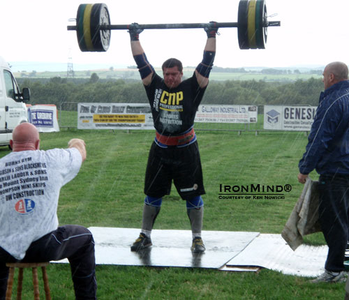 Never mind the rain: Ken Nowicki hits 145 kg in the overhead Axle, on his way to breaking the Scottish record with 160 kg.  IronMind® | Courtesy of Ken Nowicki.