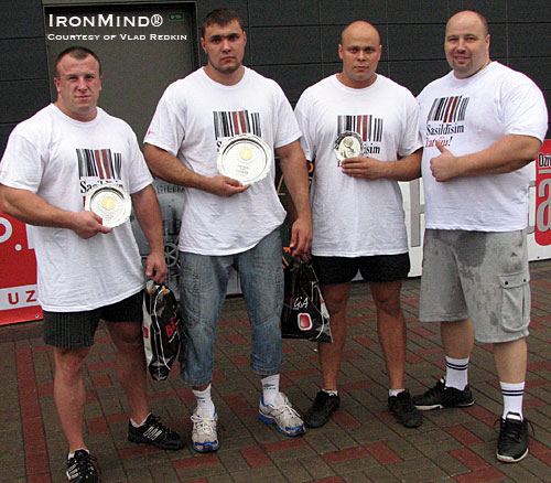 Left to right: Lauris Gabrans (second place), Roberts Kieperszo (first place), Oskars Laksa (third place) and and Guntars Kusinsh (president of LSAF, Latvian Federation for Amateur Strongman).  IronMind® | Photo courtesy of Vlad Redkin.