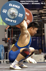 Li Hongli hits the bottom, and pay dirt, with this 165-kg snatch. IronMind® | Randall J. Strossen, Ph.D. photo.