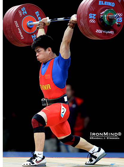 Olympic weightlifter Lin Qingfeng won the gold medal in the men’s 69-kg category with this opening clean and jerk of 182 kg.  If it looked easy, maybe that’s why he went on to take 198 kg on his third attempt.  IronMind® | Randall J. Strossen photo.