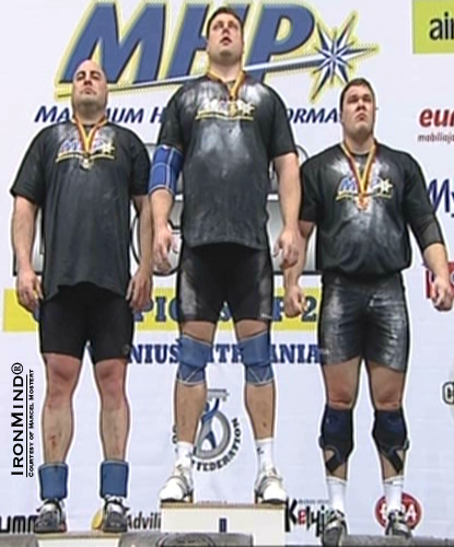 Flanked by his teammates Vidas Bleikaitis (left) and Vytautas Lalas (right), Zydrunas Savickas (center) was king of the hill at the 2011 Log Lift World Championships.  IronMind® | Courtesy of Marcel Mostert.