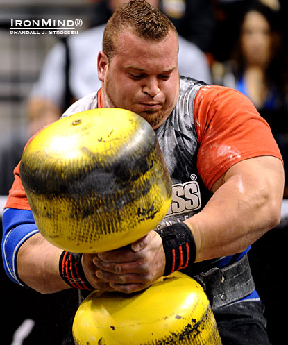 Louis-Philippe Jean works on the Circus Dumbbell, part of the overhead medley at the 2010 World Strongman Super Series–Mohegan Sun.  IronMind® | Randall J. Strossen photo.