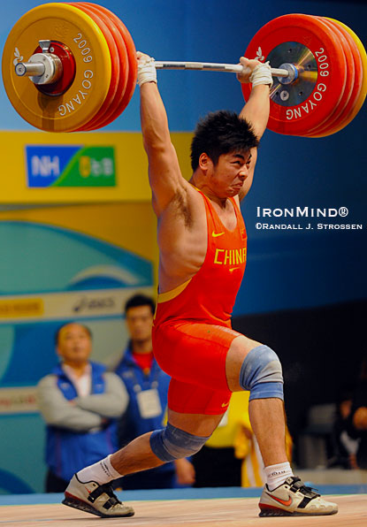 Lu Yong  missed the jerk on this 211-kg third attempt, but he completed China’s sweep of the first five men’s classes at the 2009 World Weightlifting Championships.  IronMind® | Randall J. Strossen photo.
