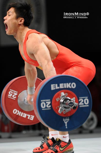 Lu Xiaojun flexed his muscles early, as he won the snatch with 170 kg in the men’s 77-kg category at the 2011 World Weightlifting Championships.  IronMind® | Randall J. Strossen photo.