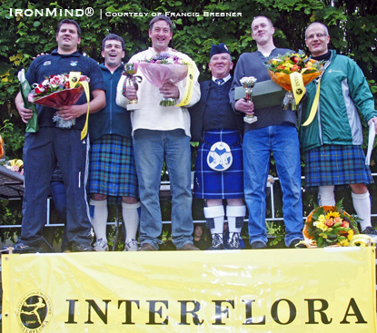 Still giving the young guys a run for their money, Bruce Aitken (center) prevailed at Luzarches, France, but watch out International Highland Games Federation (IHGF) masters because Aitken plans to join your ranks next year.  IronMind® | Photo courtesy of Francis Brebner.