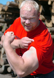 World's Strongest Man winner Magnus Samuelsson shows what we're talking about when he flexes his arm at the 2004 World Muscle Power Championships (Dolbeau-Mistassini, Quebec). IronMind® | Randall J. Strossen, Ph.D. photo.