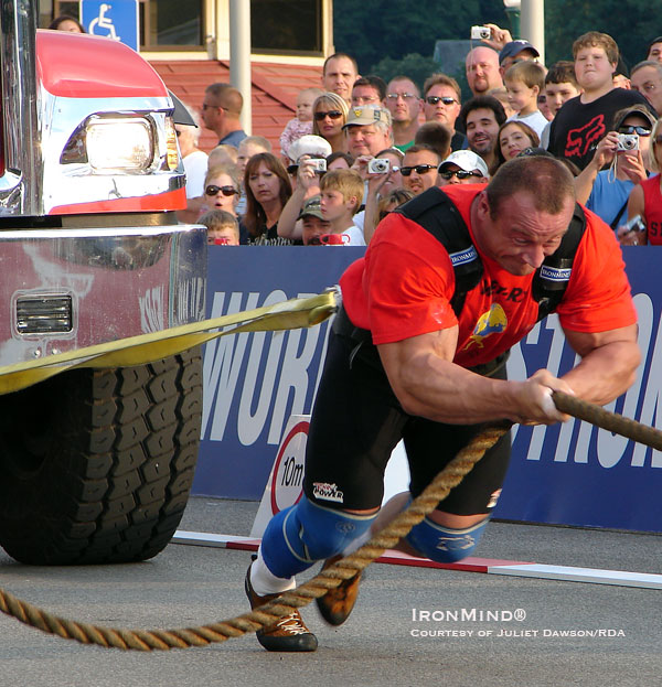 It’s the archetypal strongman contest, event and competitor: Mariusz Pudzianowski, five-time winner of the World’s Strongest Man contest, pits his muscles against a semi in the truck pull.  IronMind® | Photo courtesy of RDA.