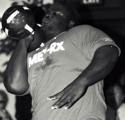 At the 2002 AOBS dinner, Mark Henry became the first man in the world to clean and press a replica of the Thomas Inch dumbbell. At this year's Arnold, one of these dumbbells will be pressed for reps. IronMind® | Randall J. Strossen, Ph.D. photo (Saddle Brook, New Jersey).